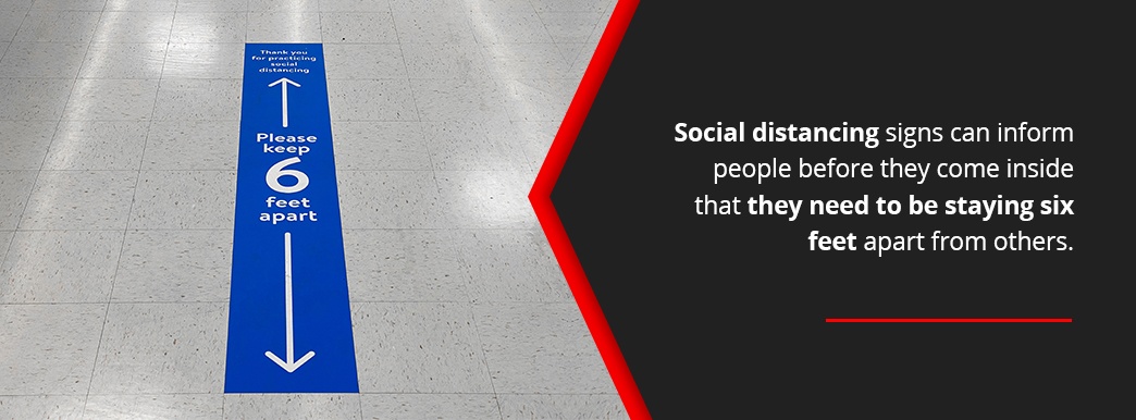 Social distancing signs to keep people 6 feet apart.