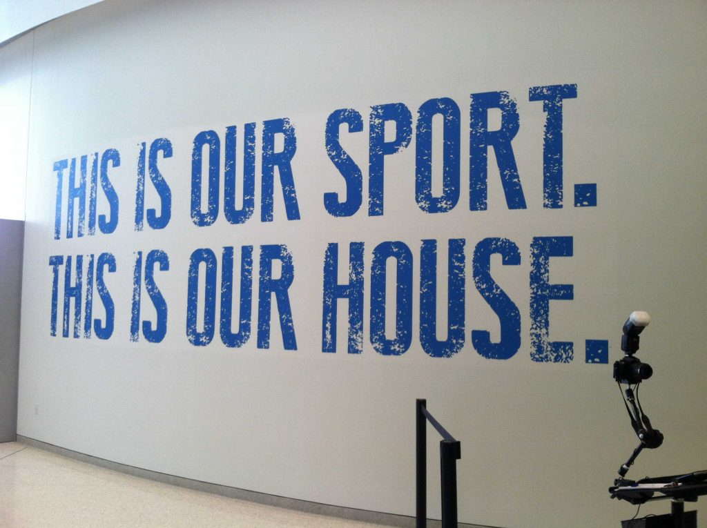 Wall graphic that says this is our sport this is our house enlarged