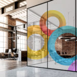 Different colored circle decals surrounding office walls. 
