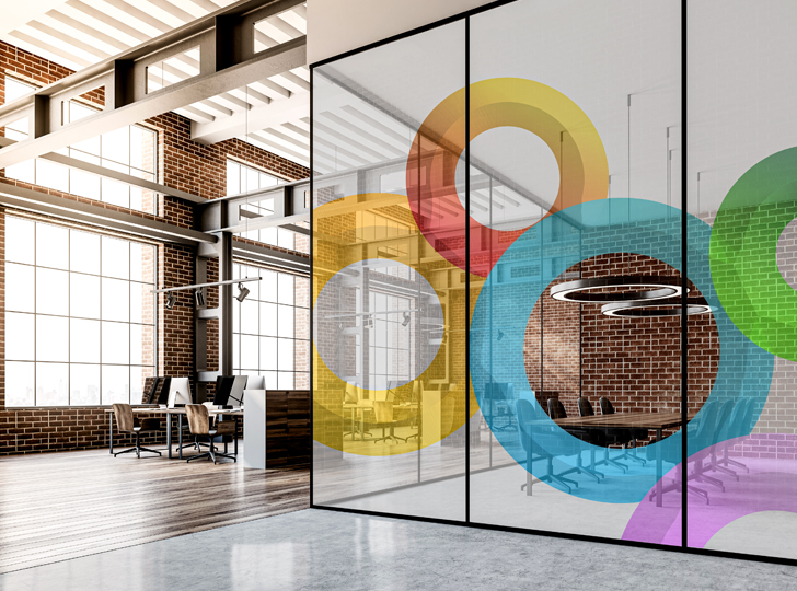 Different colored circle decals surrounding office walls. 