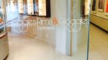 Goggles Rims & Goggles Opticians glass wall logo