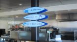Directional signage for a water park in a cafeteria