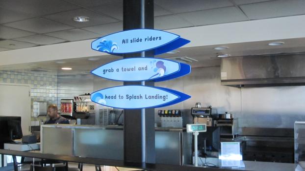 Directional signage for a water park in a cafeteria