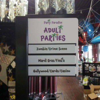 Directional signage in retail store aisle for 