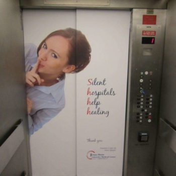 Jersey Shore Emergency Medical Center advertisement on an elevator wrap