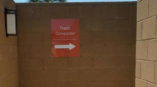 Trash compactor directional signage