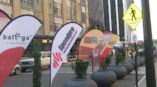 Different flag banners on a city street