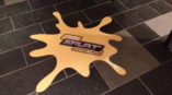 Splat Master floor graphic on tile floor