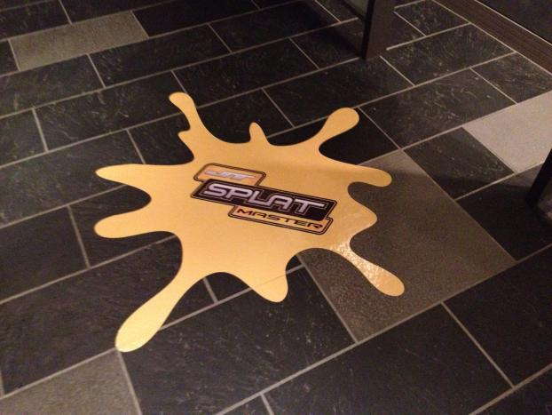 Splat Master floor graphic on tile floor