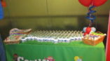 Event table with balloons and bottles of water