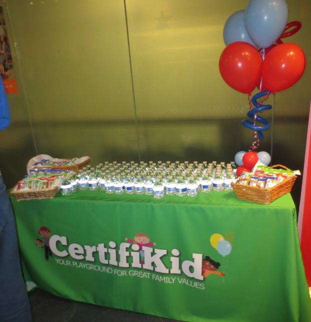 Event table with balloons and bottles of water