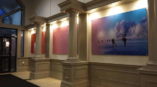 Wall photo of people ice skating in a hallway