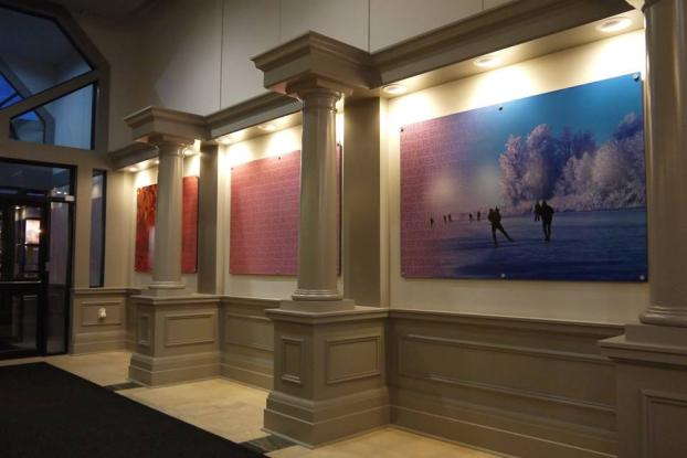 Wall photo of people ice skating in a hallway