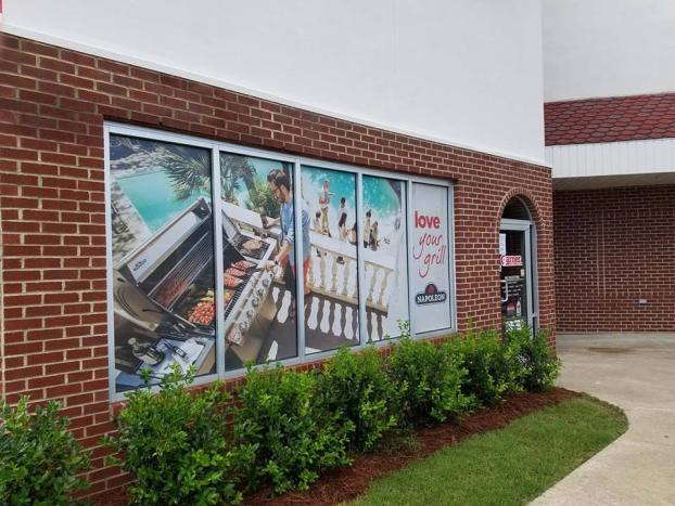 Napoleon window advertisement of a cookout