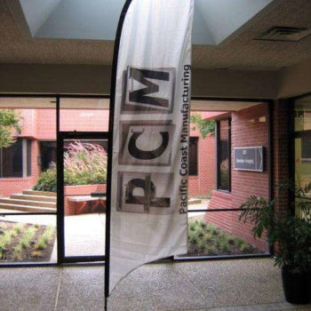Pacific Coast Manufacturing flag banner set up indoors