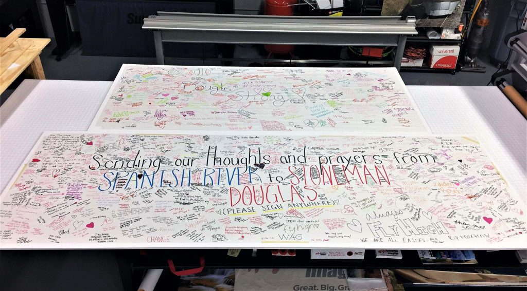 Student banner sending our thoughts and prayers