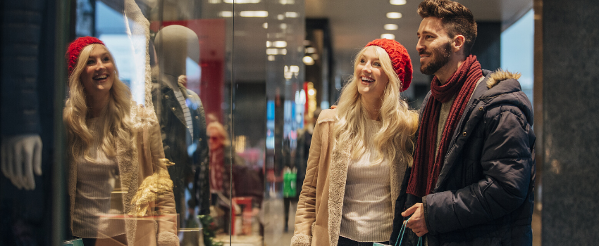 Young man and woman window shopping. 